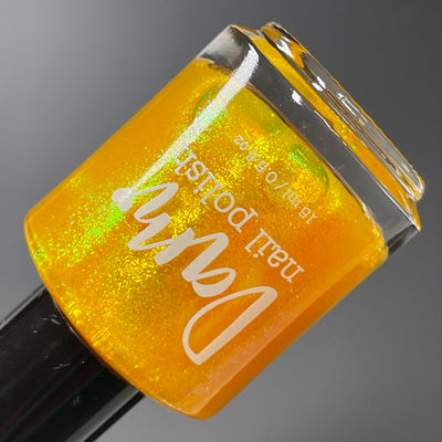 Monkey by Dam Nail Polish, sunny amber-yellow shimmer with yellow-to-green shift, bottle standalone product shot