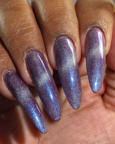 Ally by Glitch Lacquer, silver holographic magnetic topper over mauve-purple, on deep skin tone almond nails