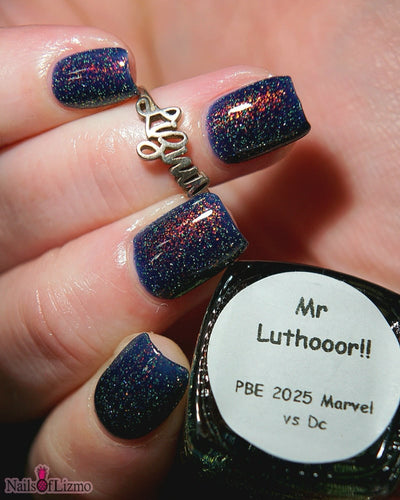 Mr Luthoooor by Danglefoot Nail Polish, blue-green multichrome reflective shimmer glitter on a light skin tone hand