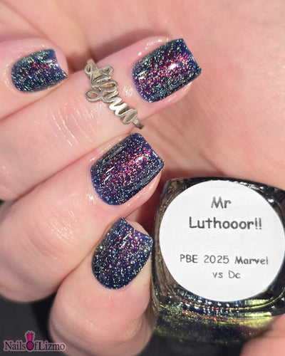 Mr Luthoooor by Danglefoot Nail Polish, blue-green multichrome reflective shimmer glitter on a light skin tone hand