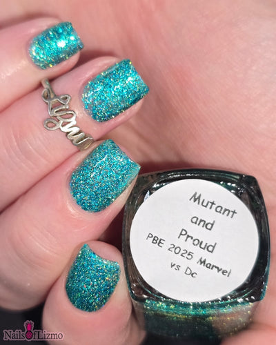 Mutant and Proud by Danglefoot Nail Polish, green-teal holographic reflective glitter flakie on a light skin tone hand