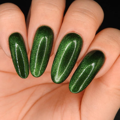 New Divide by Danglefoot Nail Polish, green shimmer jelly magnetic on a light-medium skin tone hand