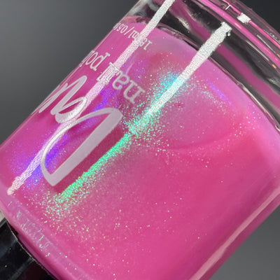 Pig by Dam Nail Polish, macro close-up of magenta-pink base with green-to-blue-violet shifting shimmer and holographic scatter