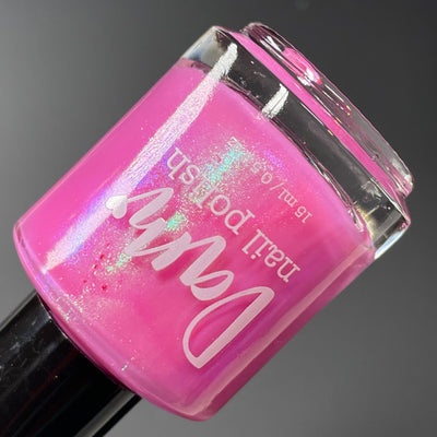 Pig by Dam Nail Polish, vivid hot pink base with green-to-blue color-shifting shimmer, bottle standalone product shot