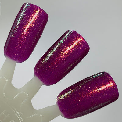 Should I Stay by Dam Nail Polish, deep fuchsia-magenta jelly densely packed with gold-to-green-to-blue color-shifting shimmer flakies, swatch stick