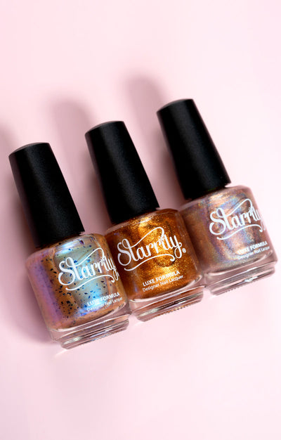 Pi Day Gift Set (Limited Edition) by Starrily, champagne-pink with blue flakies, amber-gold shimmer, and rose-gold holographic, in collection group shot on blush pink surface