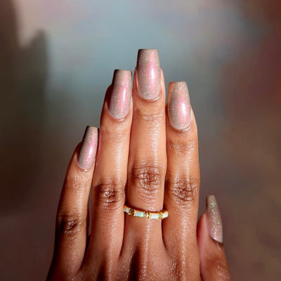 Speed Force by Danglefoot Nail Polish, black-grey holographic duochrome shimmer flakie on a medium-deep skin tone hand