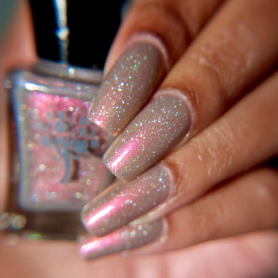 Speed Force by Danglefoot Nail Polish, black-grey holographic duochrome shimmer flakie on a medium skin tone hand