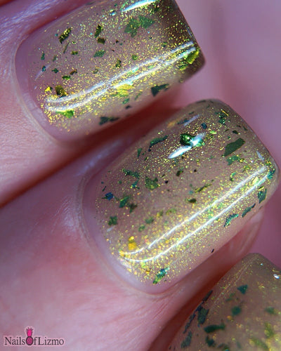 Succumb to the Fear by Danglefoot Nail Polish, macro close-up of black-gold multichrome shimmer flakie thermal