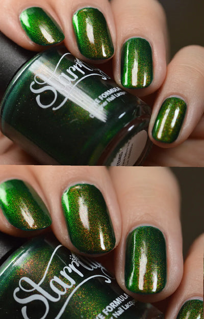 Artemis by Starrily, forest green multichrome shimmer with copper and bright green shift, glossy topcoat applied, on a light skin tone hand