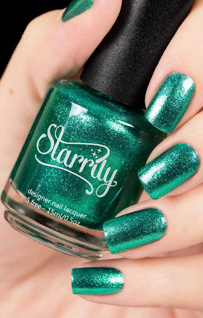 Bellatrix (Green Foil) by Starrily, deep emerald metallic foil flakie with brilliant green micro-shimmer, bottle held in a light hand