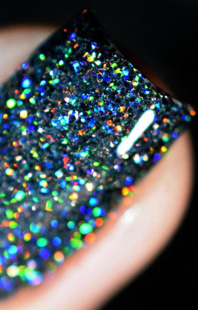 Black Diamond by Starrily, macro close-up of chunky and fine mixed holographic glitter showing vivid blue, green, and red spectral flashes in a dark base