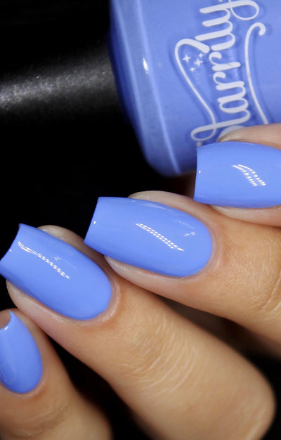 Cloudscape by Starrily, periwinkle blue creme with cornflower blue highlight, on a light-medium skin tone hand