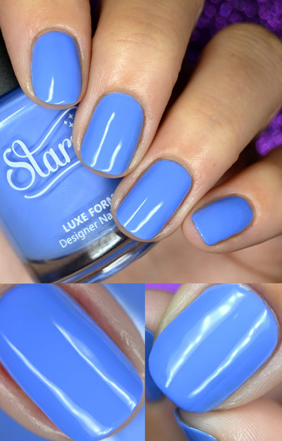 Cloudscape by Starrily, bright periwinkle blue creme, high-gloss and opaque, on a light-medium skin tone hand