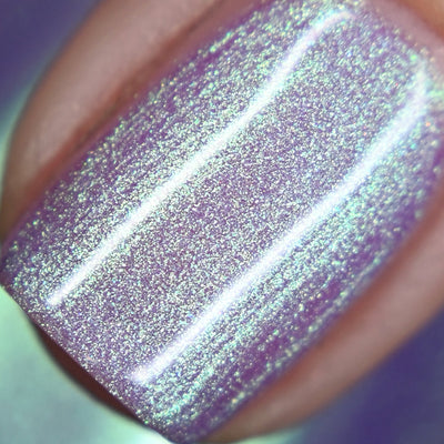 Fairy Fountain by Starrily, macro close-up of soft lilac-purple base with dense green-to-teal microshimmer flash under direct light