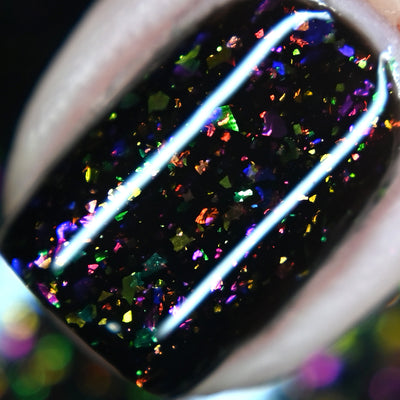 Planet X by Starrily, macro close-up of red-orange to violet multichrome flakie shift in a black jelly base