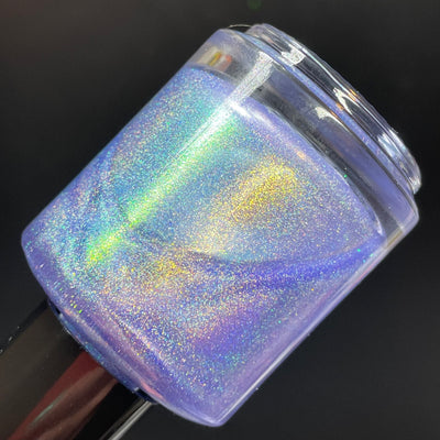 Data Is My Love Language by Dam Nail Polish, blue-leaning lavender linear holographic with vivid gold-green shimmer and full-spectrum rainbow dispersion, bottle standalone product shot