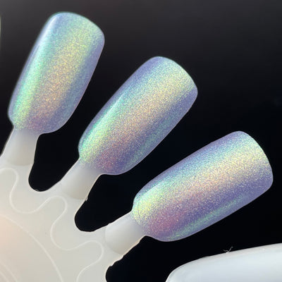 Data Is My Love Language by Dam Nail Polish, lavender linear holographic showing gold-green shift and pink-lilac secondary iridescence under flash, swatch stick