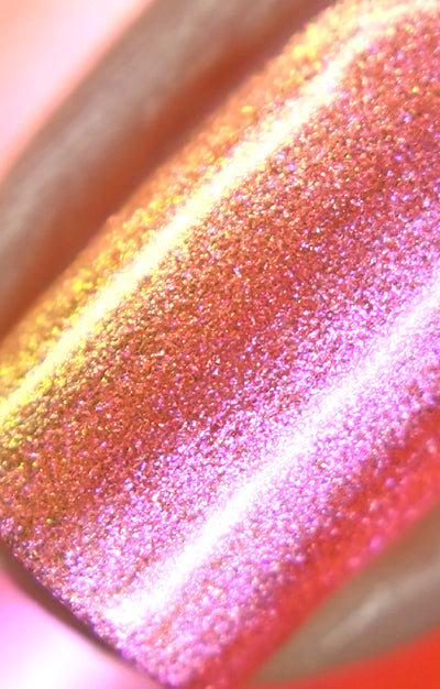 Moon Sugar by Starrily, macro close-up of dense fine micro-shimmer shifting from warm pink-rose through copper-orange to gold highlights