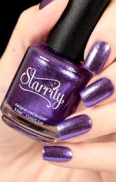 Pegasus (Purple Foil) by Starrily, deep violet-purple metallic foil with bright lavender shimmer highlights, bottle held in a light skin tone hand
