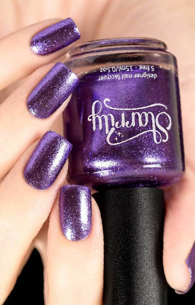 Pegasus (Purple Foil) by Starrily, multidimensional violet-purple foil with pale lilac reflective peaks, bottle held in a light skin tone hand