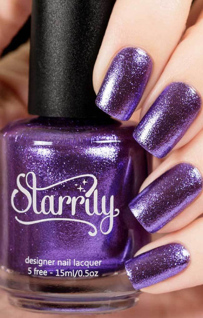 Pegasus (Purple Foil) by Starrily, violet-purple metallic foil with reflective micro flakies, bottle held in a light skin tone hand