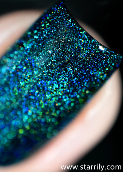 Quantum Energy by Starrily, macro close-up of densely packed emerald, teal, and cobalt blue holographic particles showing blue-to-green linear holo dispersion