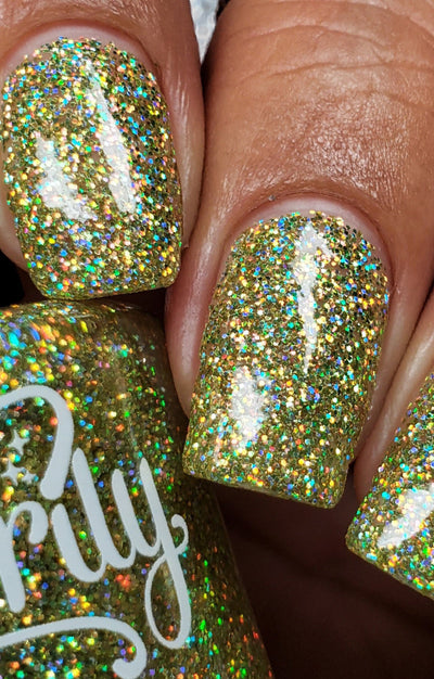 Limelight by Starrily, lime green holographic micro-glitter showing golden olive shift and intense rainbow flash under direct light, on a medium skin tone hand