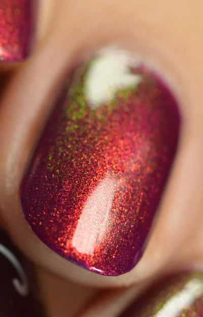 Dragon by Starrily, macro close-up of magenta-purple base with copper-red to olive-green color-shifting shimmer particles under direct flash