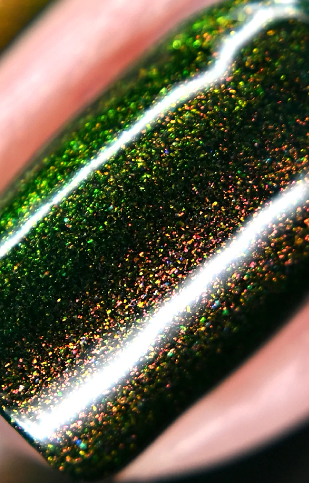 Artemis by Starrily, macro close-up of copper-to-yellow-green color-shifting shimmer flakies over deep forest green base