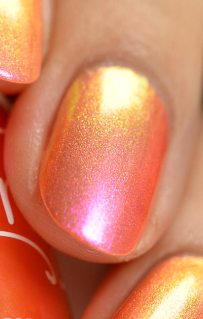 Moon Sugar by Starrily, macro close-up of orange-red base shifting through hot pink to warm gold shimmer particles under direct flash