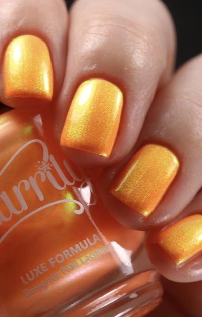 Peach Glow by Starrily, vivid orange base shifting from warm gold to chartreuse green by angle, on a light skin tone hand
