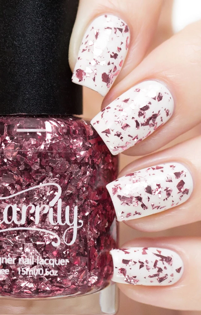Rose Quartz by Starrily, pale pink metallic flake glitter topper layered over white creme, showing densely packed rose-pink foil shards, layering demo