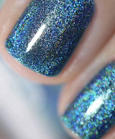 Cat Eyes by Starrily, macro close-up of dense spectral rainbow flashes over a medium blue holographic base with teal and gold shifts