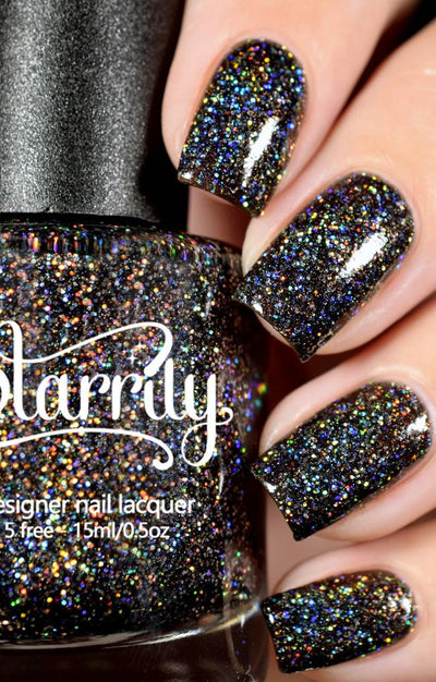 E=mc^2 by Starrily, dark charcoal grey holographic glitter jelly with rainbow prismatic scatter under direct flash, bottle held in a light skin tone hand