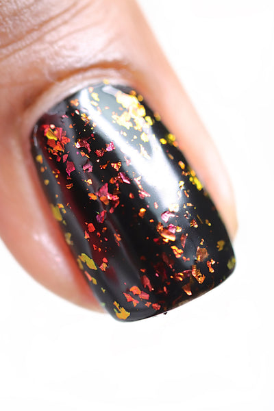 Crunchy Leaves by Starrily, gold-green multichrome flakie topper showing deep red-crimson to gold-yellow flake shift over black base, macro close-up of large irregular flakie shards